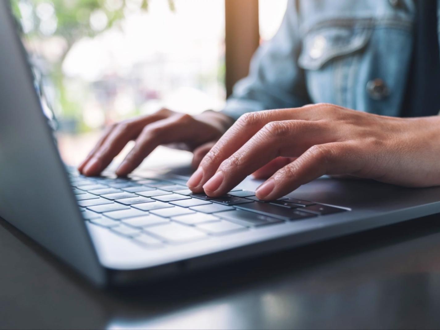 Professional working on financial analysis at a modern desk setup