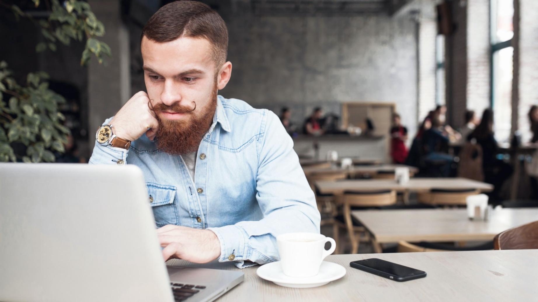 Financial analysis meeting with budget benchmarking data displayed